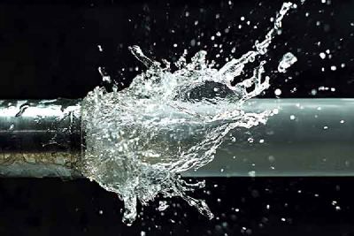 Water sprays over a metal pipe