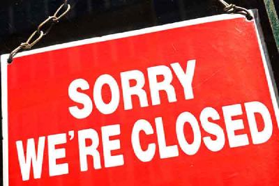 A red sign that reads Sorry We're Closed